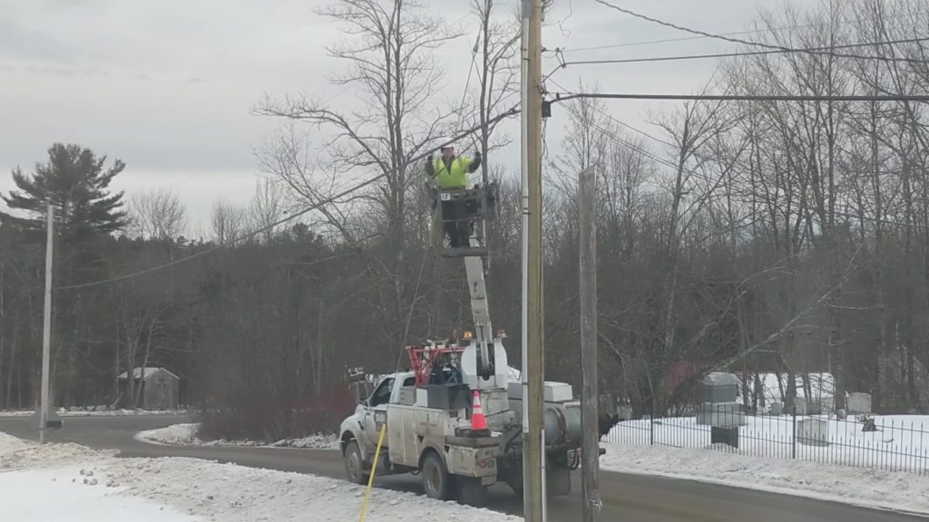 GWI line crew gives a thumbs-up after attaching fiber optic cable to a pole. January 18, 2023